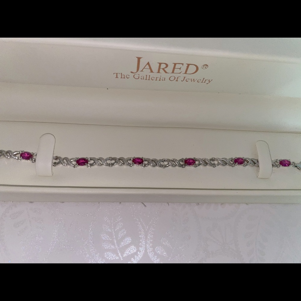 Pink Sapphire oval cut stone bracelet.